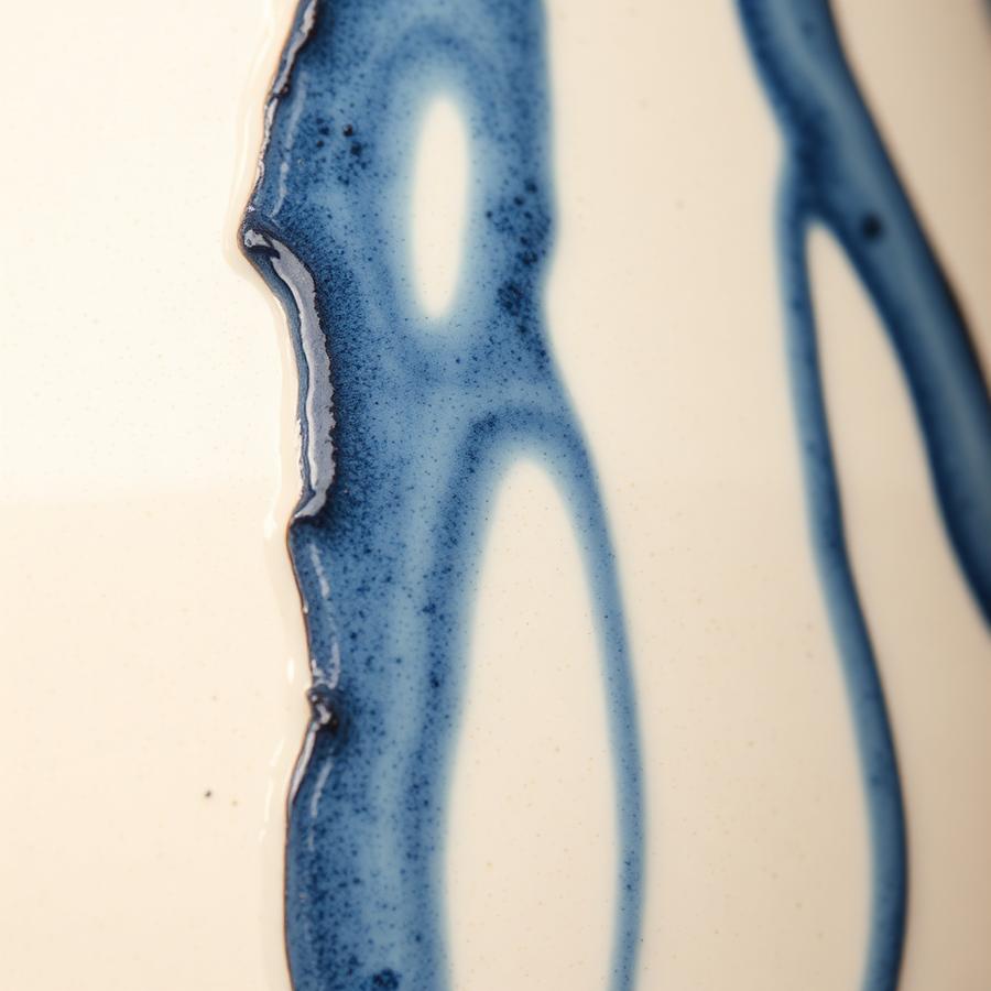 Close up of blue glaze drips
